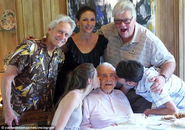 100 years young! Catherine Zeta-Jones shares heartwarming home videos of father-in-law Kirk Douglas with his grandchildren on milestone birthday